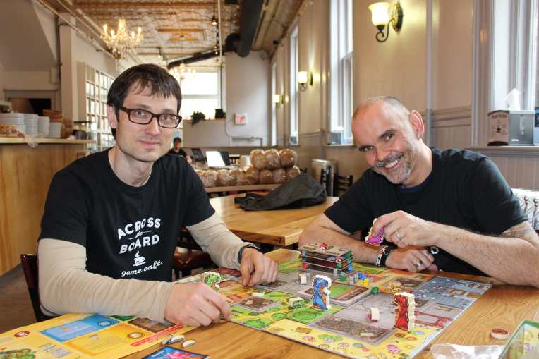 Clinton Skibitzky (left) and Olaf Pyttlik hope their new games-restaurant in Winnipeg's Exchange District sparks a gaming trend in the city. (Photo by Robin Summerfield.)