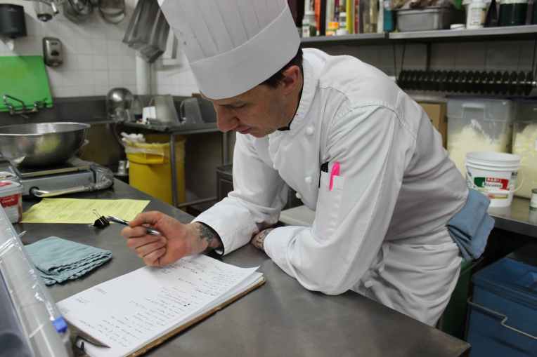 Fort Garry Hotel pastry chef Richard Warren pours over his to-do list. The Mother's Day brunch at the hotel attracts about 1,000 people and is one of the busiest days of the year. (Robin Summerfield)